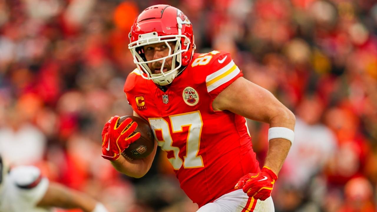 Jan 18, 2025; Kansas City, Missouri, USA; Kansas City Chiefs tight end Travis Kelce (87) runs with the ball during the first half against Houston Texans in a 2025 AFC divisional round game at GEHA Field at Arrowhead Stadium.