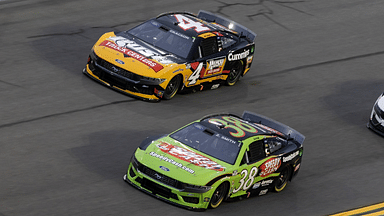 NASCAR Cup Series driver Zane Smith (38) alongside Noah Gragson (4) during practice for the Daytona 500 at Daytona International Speedway.