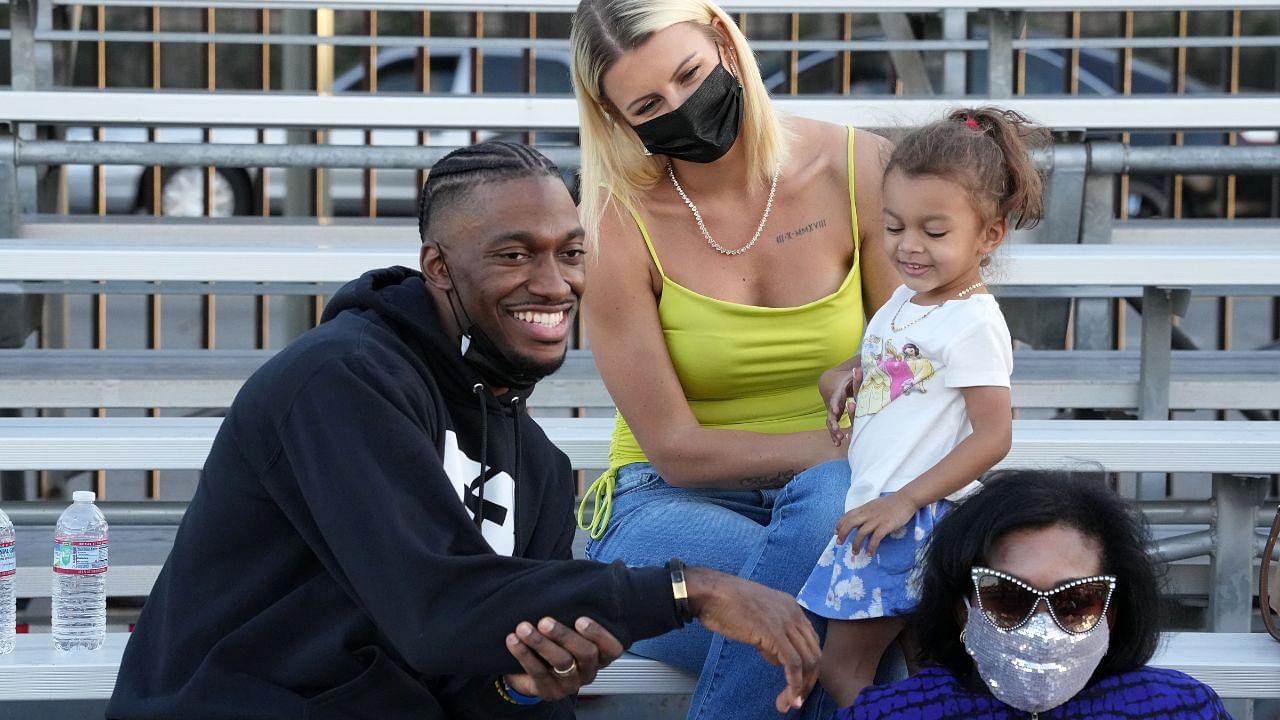 Robert Grifffin III poses with wife Grete Griffin aka Grete Sadeiko and daughter during the Salute to Service Wheelchair Football League Championship Game at the Los Angeles Memorial Coliseum.