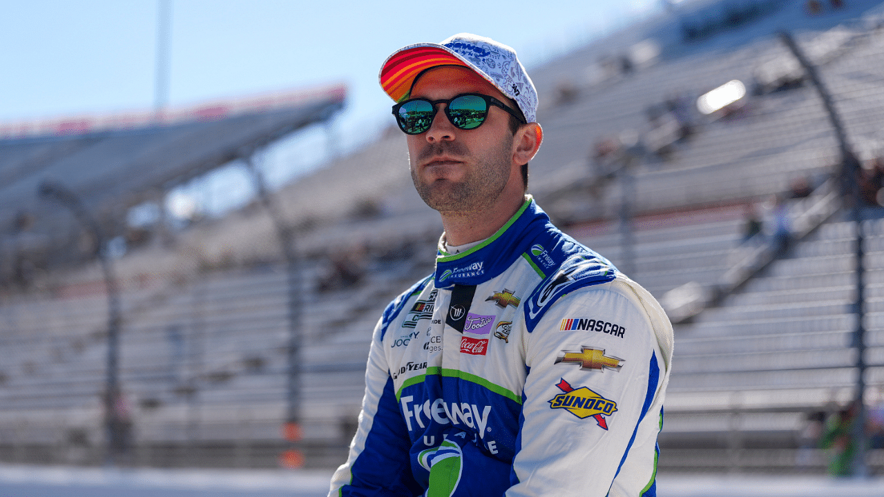 Apr 6, 2024; Martinsville, Virginia, USA; NASCAR Cup Series driver Daniel Suarez (99) looks on during practice at Martinsville Speedway. Mandatory Credit: Jim Dedmon-Imagn Images