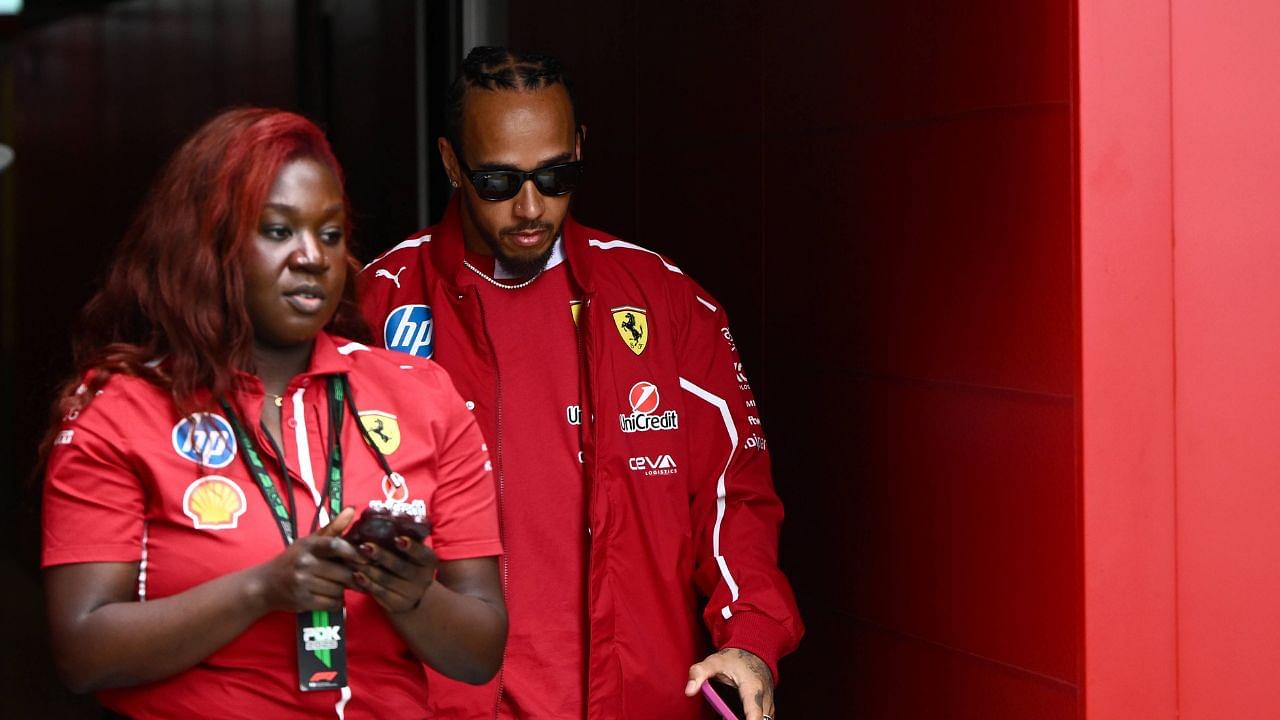 AUSTRALIAN GRAND PRIX, Lewis Hamilton of Ferrari (right) in the paddock at Albert Park Circuit in Melbourne, Victoria, Thursday, March 13, 2025