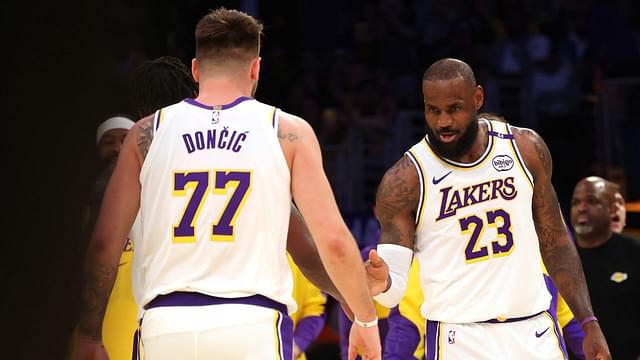 Los Angeles Lakers forward LeBron James (23) and guard Luka Doncic (77) react after a play during the first quarter against the LA Clippers at Crypto.com Arena.