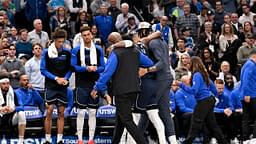 Dallas Mavericks guard Kyrie Irving (11) is helped off the court by forward Anthony Davis (3) during the second quarter against the Sacramento Kings at the American Airlines Center.