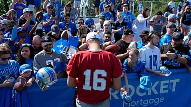 Detroit Lions quarterback Jared Goff signs items for fans after practice at the Lions practice facility in Allen Park on Saturday, July 27, 2024. This was the first time during this training camp that fans were allowed to watch practice and stay afterwards to see the players up close.