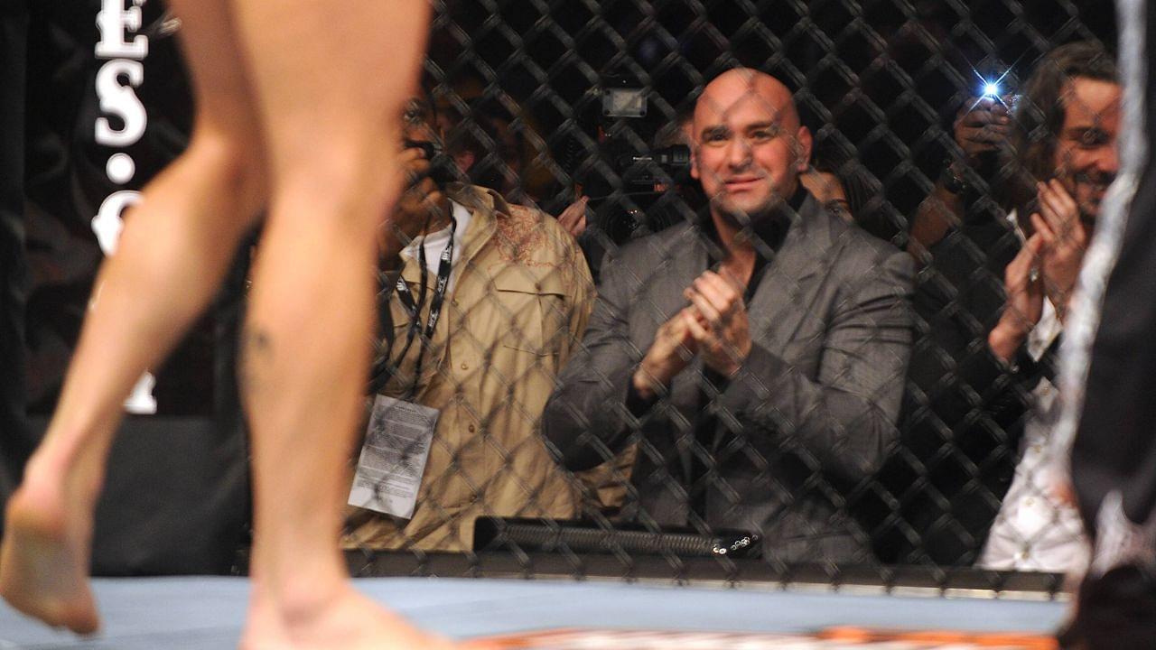 UFC President Dana White watches the match with a smile.