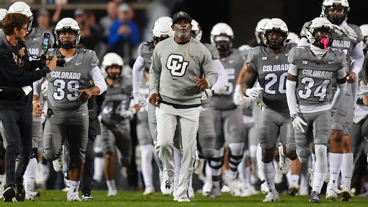 Oct 26, 2024; Boulder, Colorado, USA; Colorado Buffaloes head coach Deion Sanders leads out the team before the game against the Cincinnati Bearcats at Folsom Field.