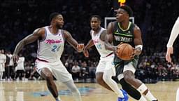 Minnesota Timberwolves guard Anthony Edwards (5) looks for a passing lane as Miami Heat forward Haywood Highsmith (24) and guard Davion Mitchell (45) defend during the second half at Kaseya Center.