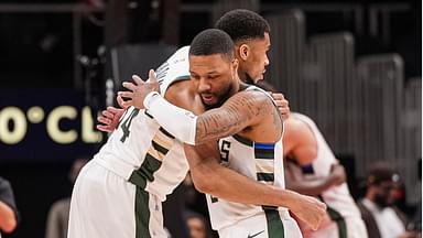 Milwaukee Bucks forward Giannis Antetokounmpo (34) and guard Damian Lillard (0) react after defeating the Atlanta Hawks at State Farm Arena.