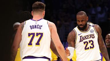 Los Angeles Lakers forward LeBron James (23) and guard Luka Doncic (77) react after a play during the first quarter against the LA Clippers at Crypto.com Arena.