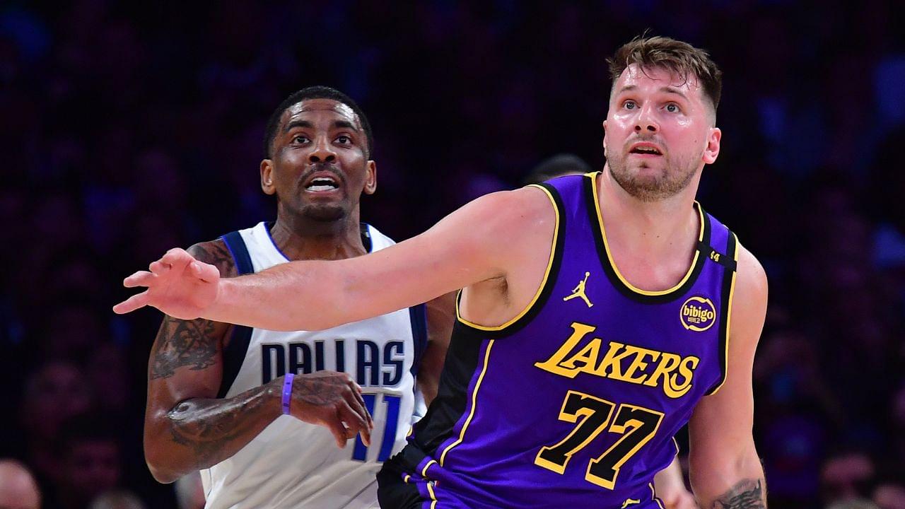 Los Angeles Lakers guard Luka Doncic (77) and Dallas Mavericks guard Kyrie Irving (11) attempt to gain control during the first quarter at Crypto.com Arena.