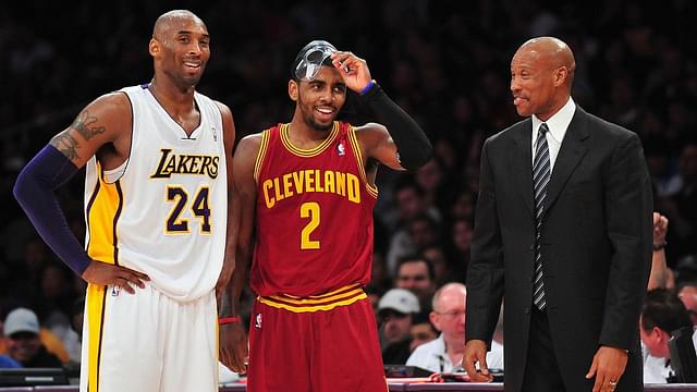 Cleveland Cavaliers head coach Byron Scott speaks with point guard Kyrie Irving (2) and Los Angeles Lakers shooting guard Kobe Bryant (24) during the first half at Staples Center.