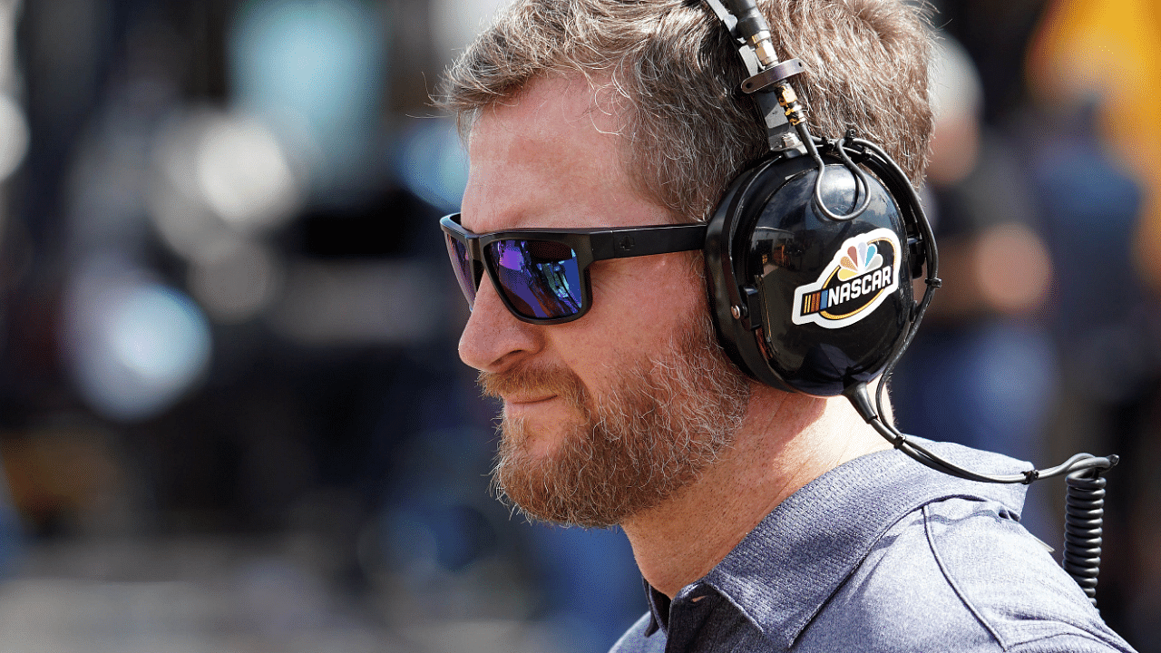 Oct 11, 2019; Talladega, AL, USA; Former NASCAR driver and TV analyst Dale Earnhardt Jr. reporting in the garage area for NBCsn during practice for the 1000Bulbs.com 500 at Talladega Superspeedway. Mandatory Credit: John David Mercer-Imagn Images