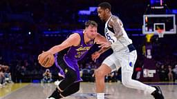 Los Angeles Lakers guard Luka Doncic (77) dribbles the ball against Dallas Mavericks forward P.J. Washington (25) during the second half at Crypto.com Arena.