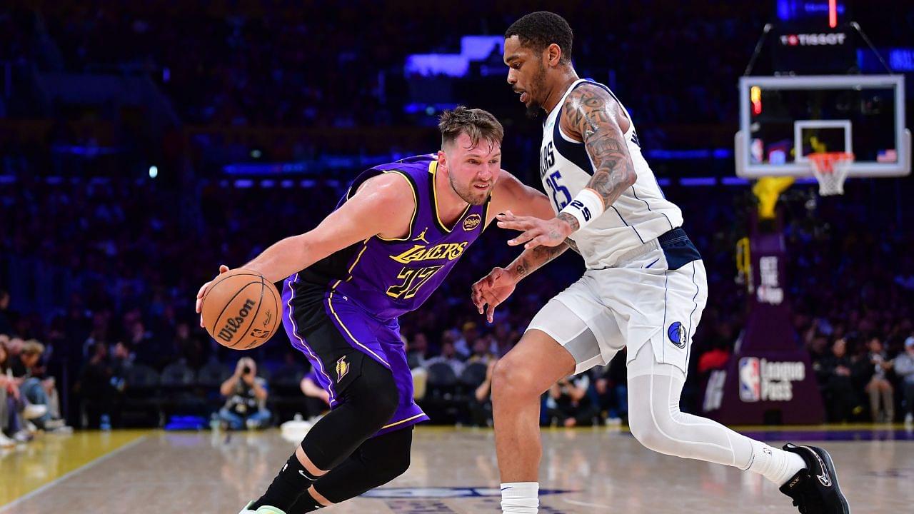 Los Angeles Lakers guard Luka Doncic (77) dribbles the ball against Dallas Mavericks forward P.J. Washington (25) during the second half at Crypto.com Arena.