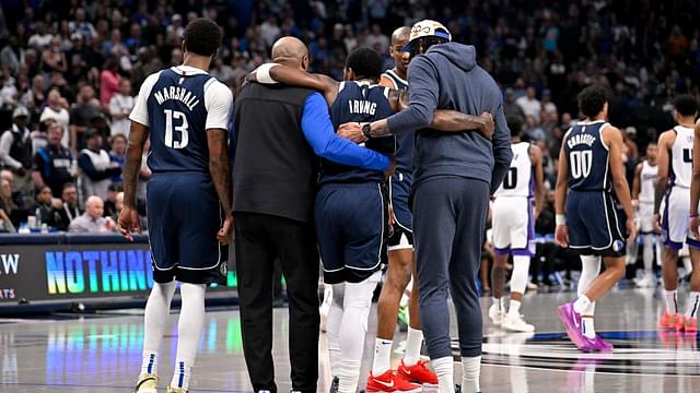 Mar 3, 2025; Dallas, Texas, USA; Dallas Mavericks guard Kyrie Irving (11) is helped off the court by forward Naji Marshall (13) and forward Anthony Davis (3) during the second quarter against the Sacramento Kings at the American Airlines Center. Mandatory Credit: Jerome Miron-Imagn Images