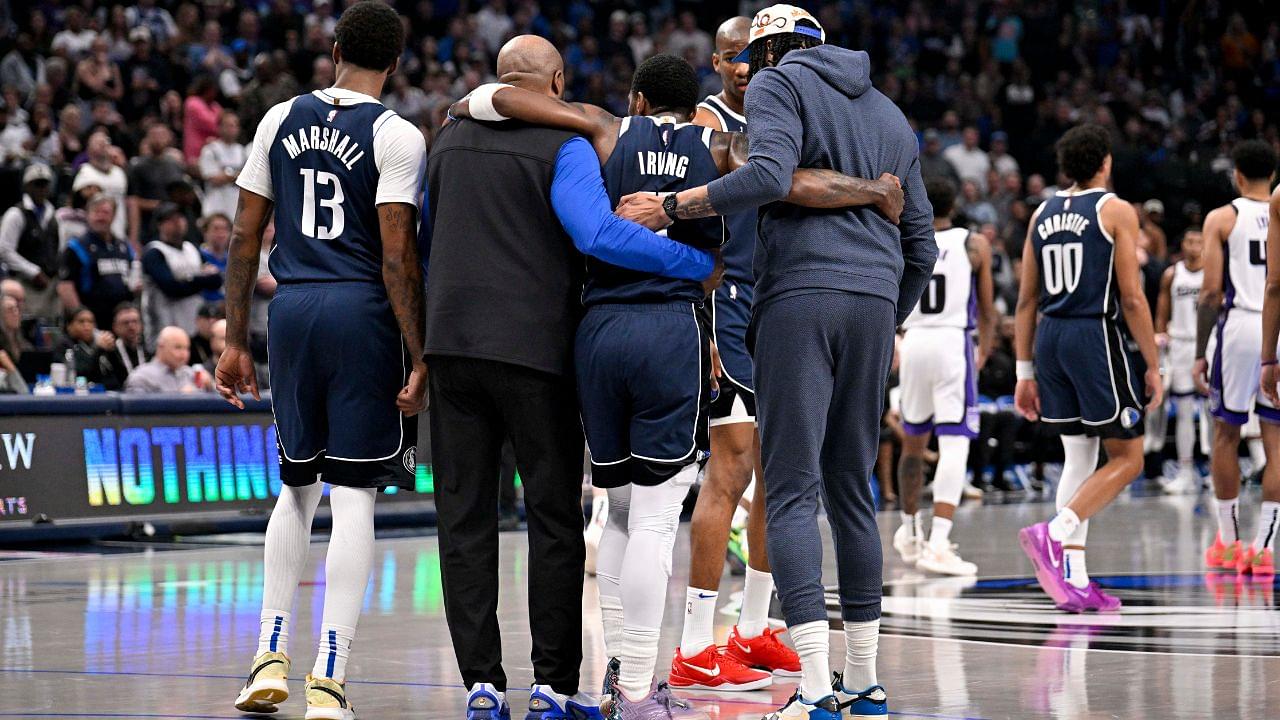 Mar 3, 2025; Dallas, Texas, USA; Dallas Mavericks guard Kyrie Irving (11) is helped off the court by forward Naji Marshall (13) and forward Anthony Davis (3) during the second quarter against the Sacramento Kings at the American Airlines Center. Mandatory Credit: Jerome Miron-Imagn Images