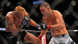 Nate Diaz (red gloves) fights Tony Ferguson (blue gloves) during UFC 279 at T-Mobile Arena.