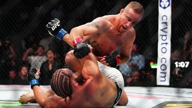 Justin Gaethje (red gloves) fights Rafael Fiziev (blue gloves) during UFC 313 at T-Mobile Arena.