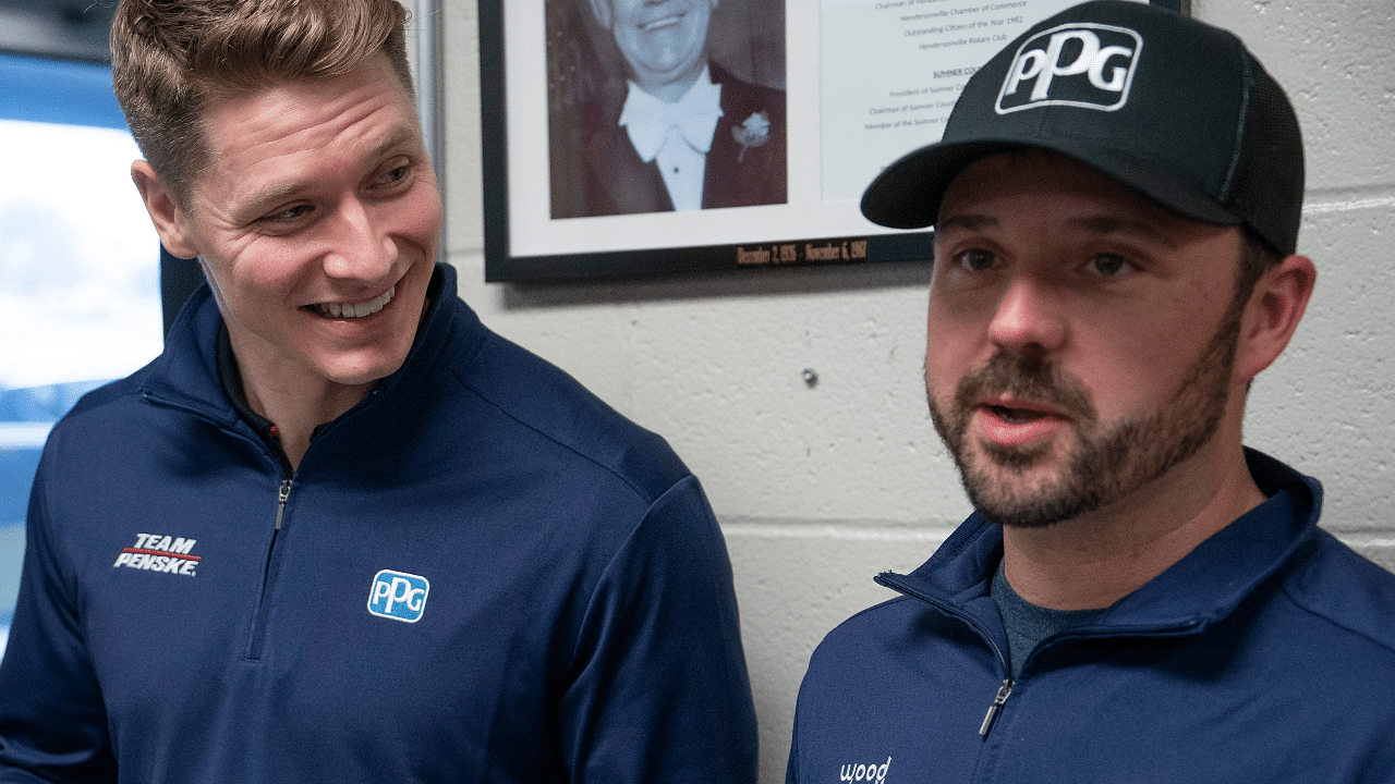 Two-time Indianapolis 500 winner Josef Newgarden, left, and NASCAR Cup Series driver Josh Berry get a copy of their eighth-grade class schedules in the office of Robert E. Ellis Middle School in Hendersonville, Tenn., Wednesday, Feb. 5, 2025. Both of the drivers are from Hendersonville and attended the school at the same time (although they didn't know each other).