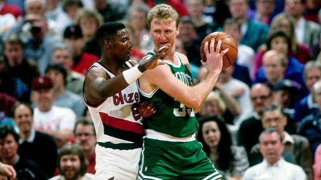 Boston Celtics forward Larry Bird (33) is defended by Portland Trail Blazers forward Jerome Kersey (25) at Memorial Coliseum