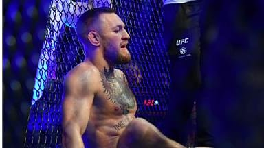 Conor McGregor reacts following an injury suffered against Dustin Poirier during UFC 264 at T-Mobile Arena.