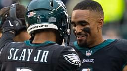 Philadelphia Eagles quarterback Jalen Hurts (1) talks with cornerback Darius Slay (2) after his interception return for a touchdown against the New Orleans Saints during the second quarter at Lincoln Financial Field.