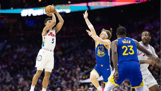 Philadelphia 76ers guard Quentin Grimes (5) scores past Golden State Warriors guard Brandin Podziemski (2) during the second quarter at Wells Fargo Center