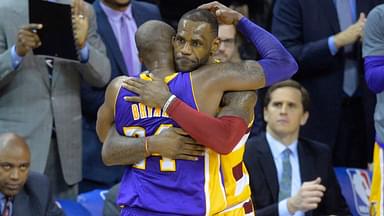 Cleveland Cavaliers forward LeBron James (23) hugs Los Angeles Lakers forward Kobe Bryant (24) near the end of the Cavaliers' 120-111 win at Quicken Loans Arena