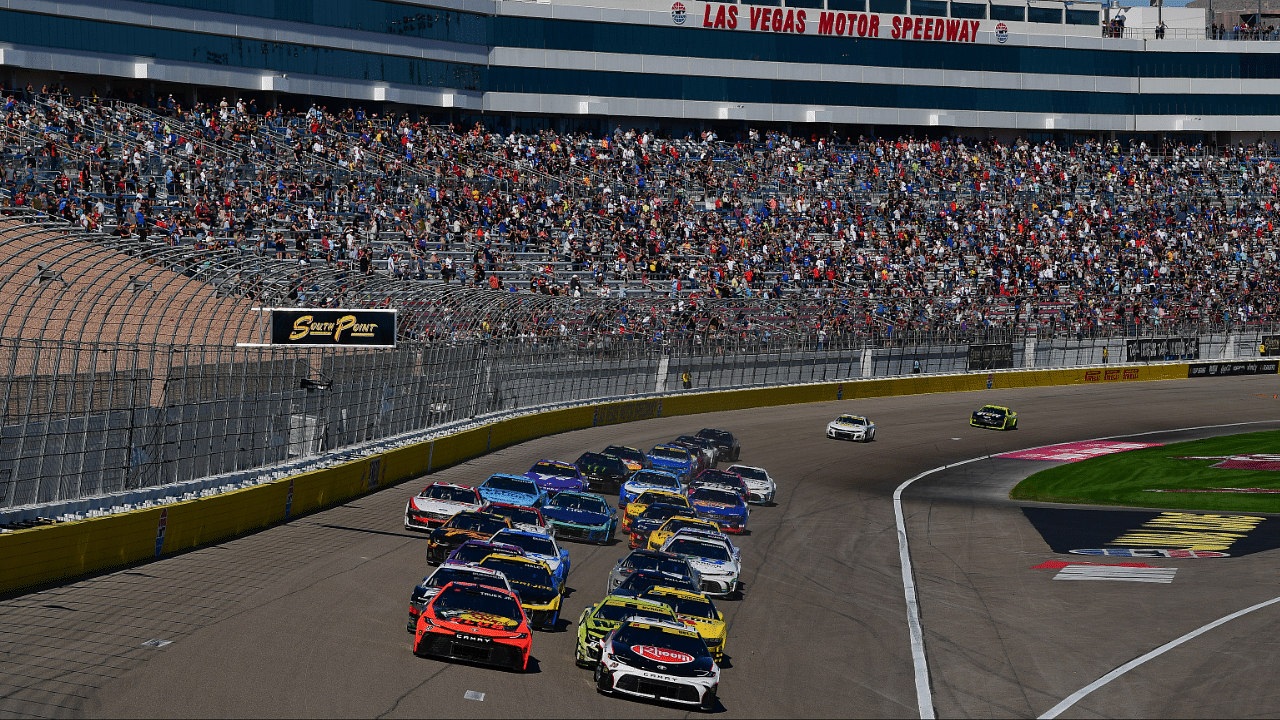 Oct 20, 2024; Las Vegas, Nevada, USA; NASCAR Cup Series driver Christopher Bell (20) leads the restart of the South Point 400 at Las Vegas Motor Speedway. Mandatory Credit: Gary A. Vasquez-Imagn Images