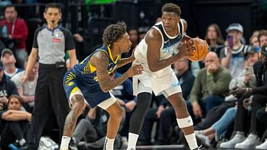 Mar 17, 2025; Minneapolis, Minnesota, USA; Minnesota Timberwolves guard Anthony Edwards (5) holds the ball as Indiana Pacers guard Quenton Jackson (29) plays defense in the second half at Target Center. Mandatory Credit: Jesse Johnson-Imagn Images