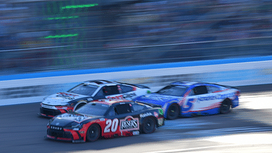 Mar 9, 2025; Avondale, Arizona, USA; NASCAR Cup Series driver Christopher Bell (20) crosses the finish line ahead of driver Denny Hamlin (11) and driver Kyle Larson (5) to win the Shriners Children’s 500 at Phoenix Raceway. Mandatory Credit: Gary A. Vasquez-Imagn Images