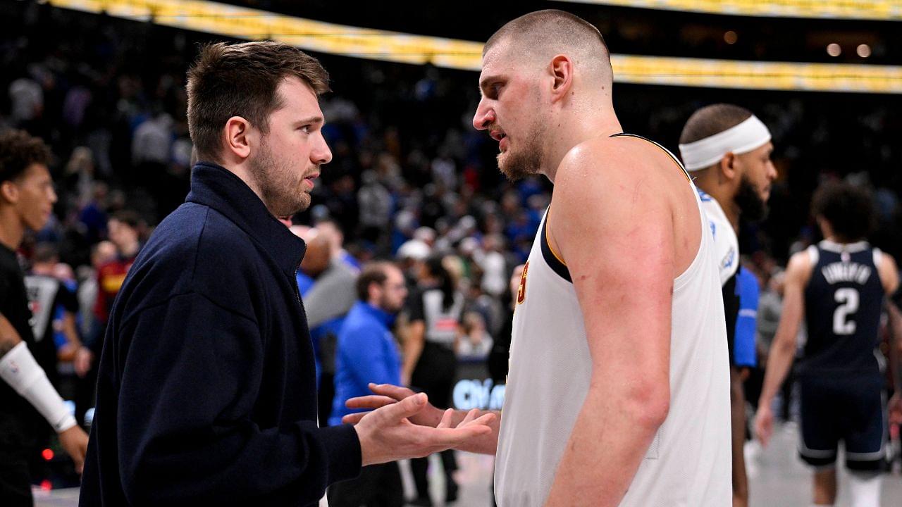 Dallas Mavericks guard Luka Doncic (left) talks with Denver Nuggets center Nikola Jokic (right) after the game at the American Airlines Center