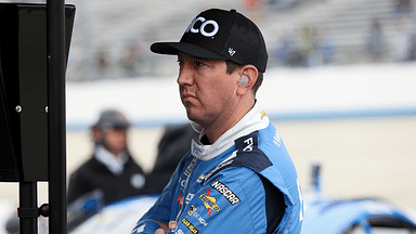 NASCAR Cup Series driver Kyle Busch looks at a computer on pit road during practice and qualifying for the Wurth 400 at Dover Motor Speedway.