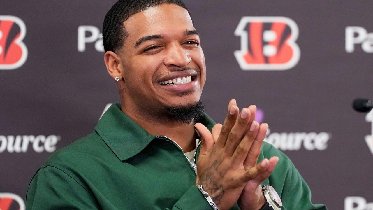 Cincinnati Bengals receiver Ja’marr Chase smiles as he takes questions during a press conference to announce the signing of new contracts for receivers Ja’Marr Chase and Tee Higgins at Paycor Stadium in downtown Cincinnati