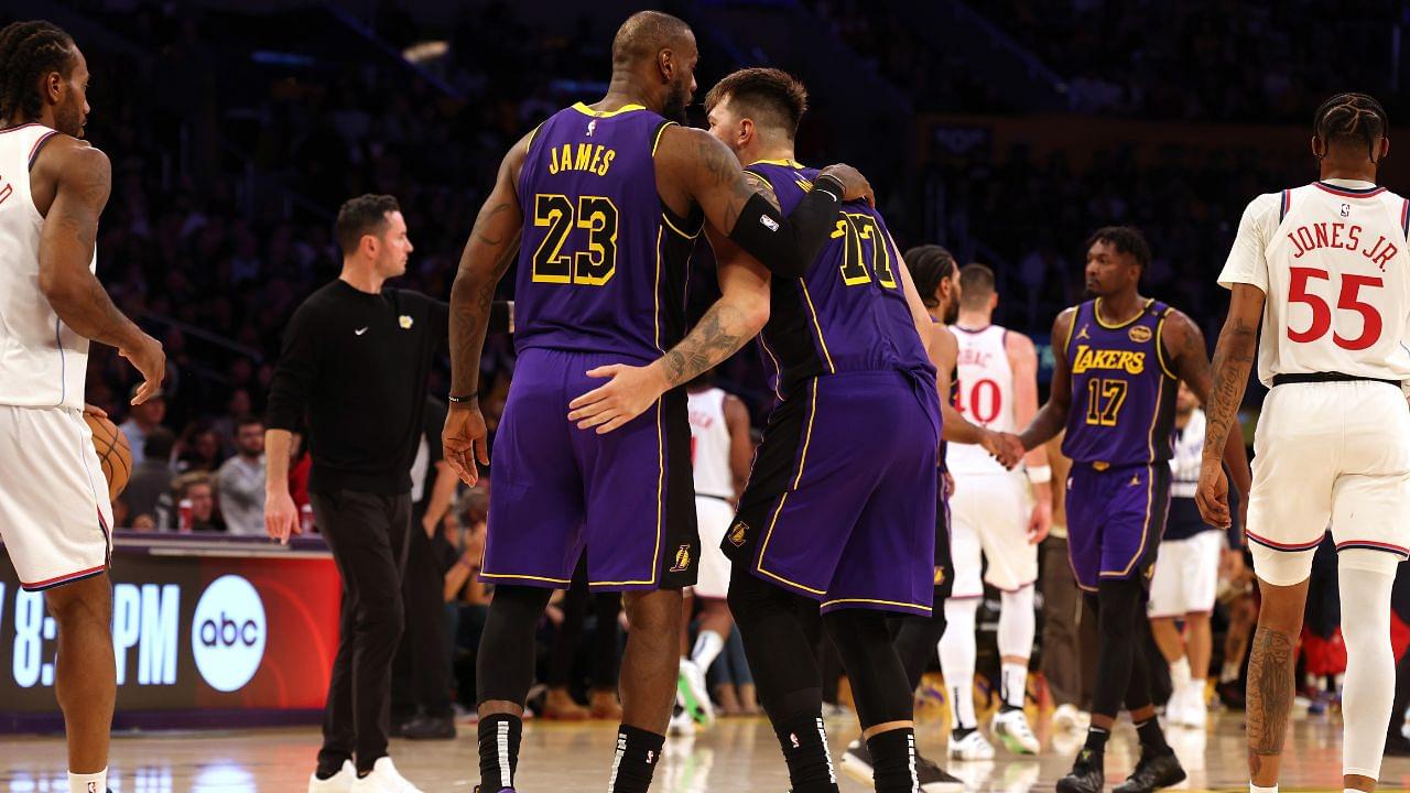 Los Angeles Lakers forward LeBron James (23) and guard Luka Doncic (77) react after a play during the fourth quarter against the LA Clippers at Crypto.com Arena.