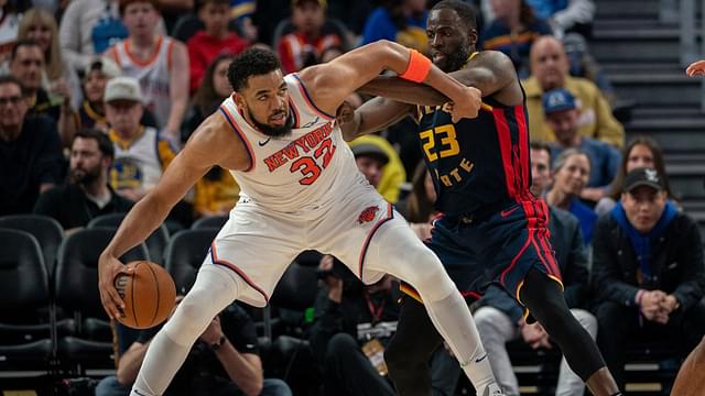 New York Knicks center Karl-Anthony Towns (32) controls the basketball against Golden State Warriors forward Draymond Green (23) during the third quarter at Chase Center.