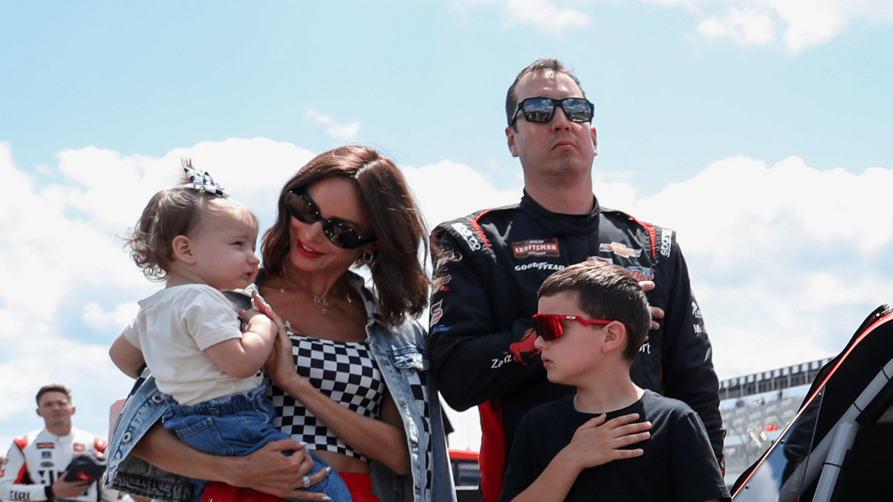 NASCAR Craftsman Truck Series driver Kyle Busch stands with his wife Samantha Busch and children Brexton and Lennix prior to the CRC Brakleen 150 at Pocono Raceway.