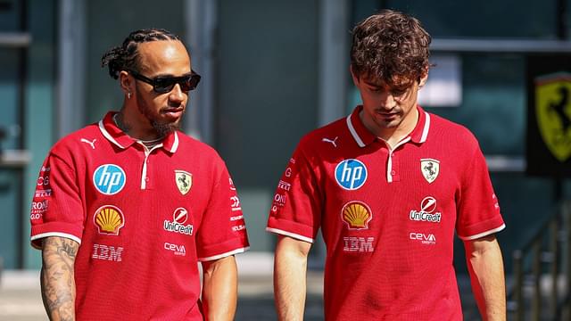 Lewis Hamilton of Great Britain and Scuderia Ferrari and Charles Leclerc of Monaco and Scuderia Ferrari walks in the paddock during practice ahead of the F1 Grand Prix of CHINA at Shanghai International Circuit