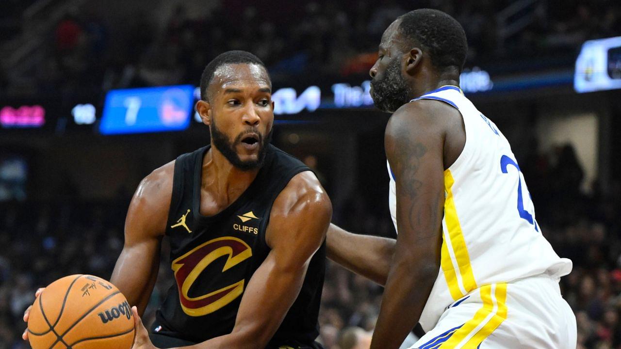 Golden State Warriors forward Draymond Green (23) defends Cleveland Cavaliers forward Evan Mobley (4) in the first quarter at Rocket Mortgage FieldHouse.