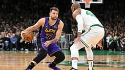 Los Angeles Lakers guard Luka Doncic (77) dribbles the ball against Boston Celtics center Al Horford (42) during the first quarter at the TD Garden