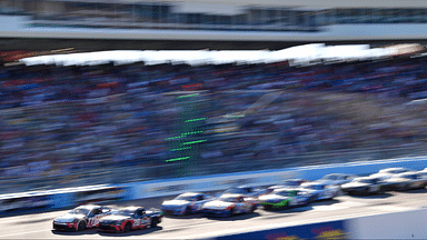 Mar 9, 2025; Avondale, Arizona, USA; NASCAR Cup Series driver Denny Hamlin (11) and driver Christopher Bell (20) lead the field during the restart of the Shriners Children’s 500 at Phoenix Raceway. Mandatory Credit: Gary A. Vasquez-Imagn Images