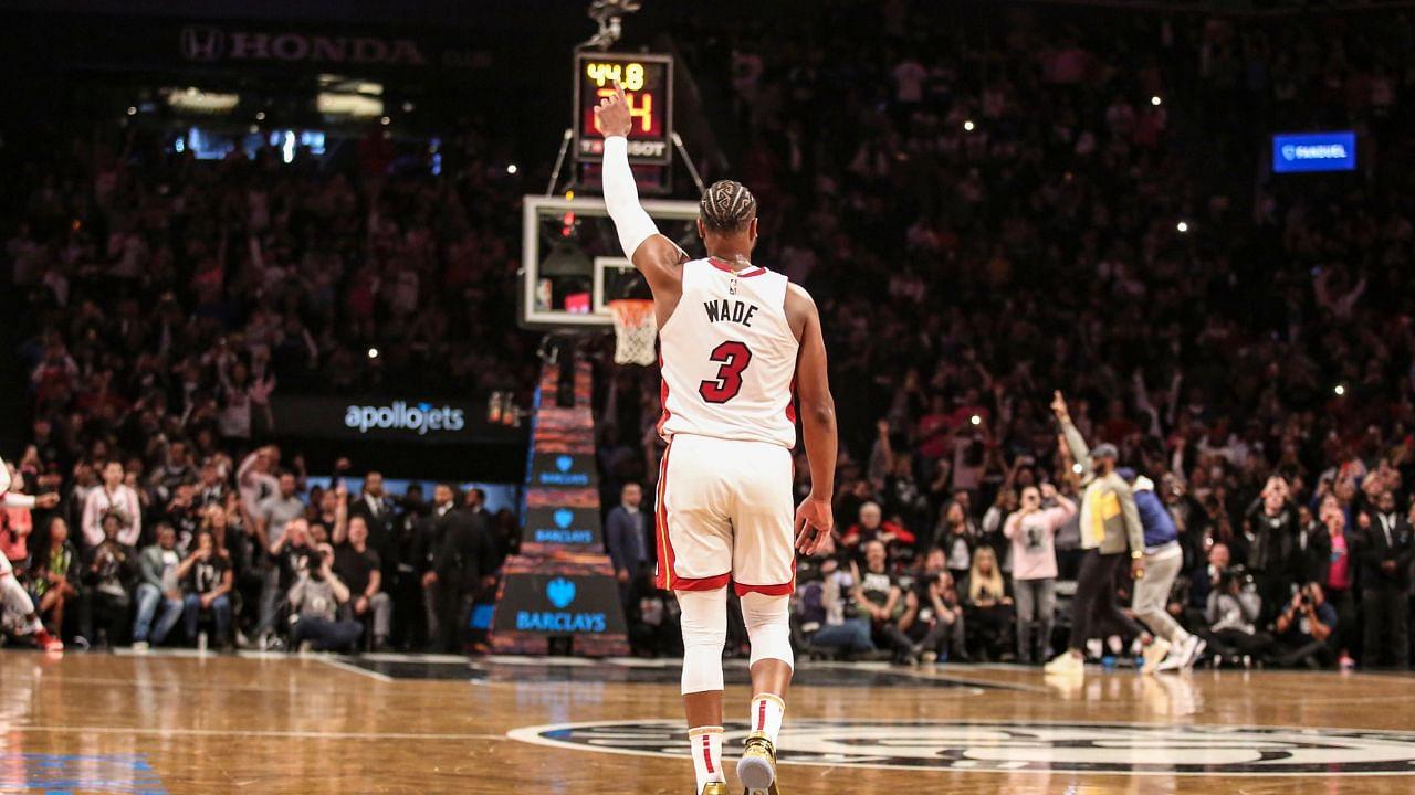 Miami Heat guard Dwyane Wade (3) signals to the crowd after scoring in the third quarter against the Brooklyn Nets at Barclays Center