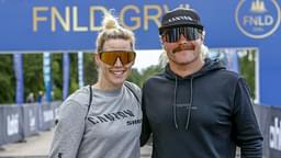 Finnish Formula 1 driver Valtteri Bottas (R) and Tiffany Cromwell pose during the FNLD GRVL gravel race event in Lahti, Finland, on June 14, 2024