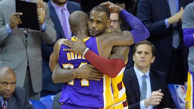 Cleveland Cavaliers forward LeBron James (23) hugs Los Angeles Lakers forward Kobe Bryant (24) near the end of the Cavaliers' 120-111 win at Quicken Loans Arena.