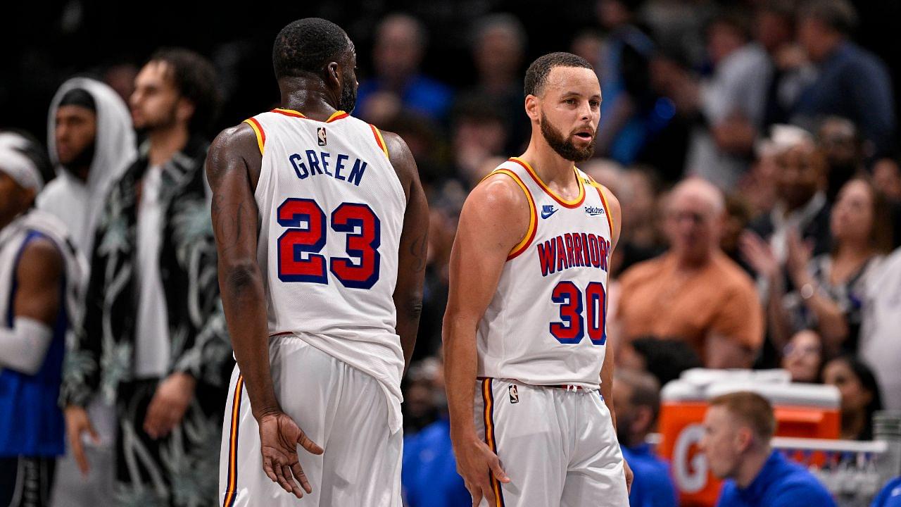 Golden State Warriors forward Draymond Green (23) and guard Stephen Curry (30) during the game between the Dallas Mavericks and the Golden State Warriors at the American Airlines Center