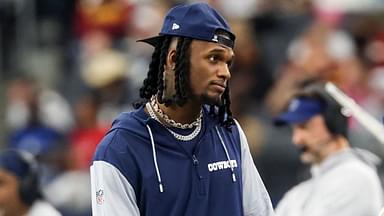 Dallas Cowboys wide receiver CeeDee Lamb watches from the sidelines during the first half against the Washington Commanders at AT&T Stadium.