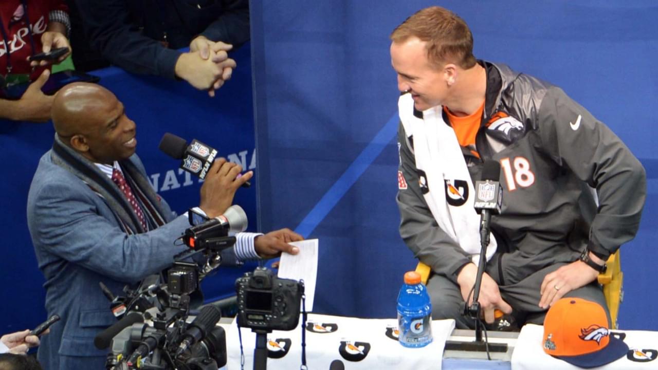 Jan 28, 2014; Newark, NJ, USA; Denver Broncos quarterback Peyton Manning is interviewed by NFL Network analyst Deion Sanders during Media Day for Super Bowl XLIII at Prudential Center.