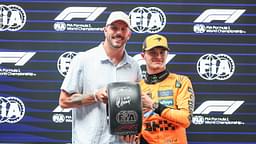 Qualifying In Melbourne, Australia, on March 15, 2025, Kyle Chalmers of Australia and Olympic Swimming Champion presents the Pirelli Pole Position award to Lando Norris of Great Britain and the McLaren F1 Team during Qualifying ahead of the F1 Grand Prix of Australia at Albert Park Circuit