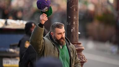 Jason Kelce gestures to fans during the Super Bowl LIX championship parade and rally.