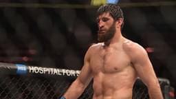 Magomed Ankalaev (blue gloves) reacts during the fight against Jan Blachowicz (red gloves) during UFC 282 at T-Mobile Arena.